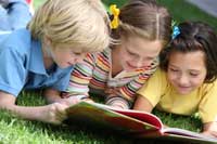 Kids Reading Outside